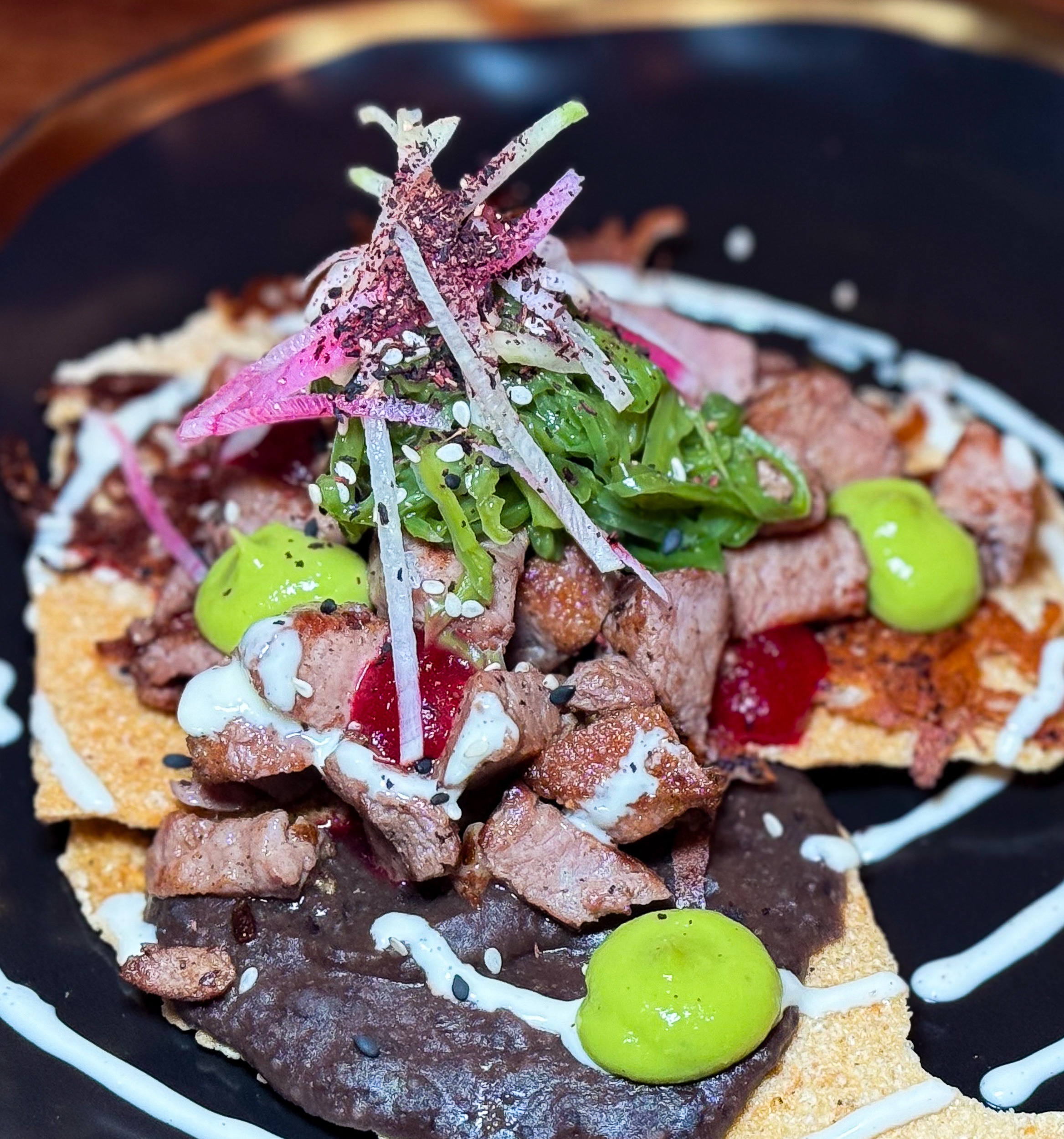 Tostada Flank Steak w refried beans Mezcal & Sal Puerto Vallarta