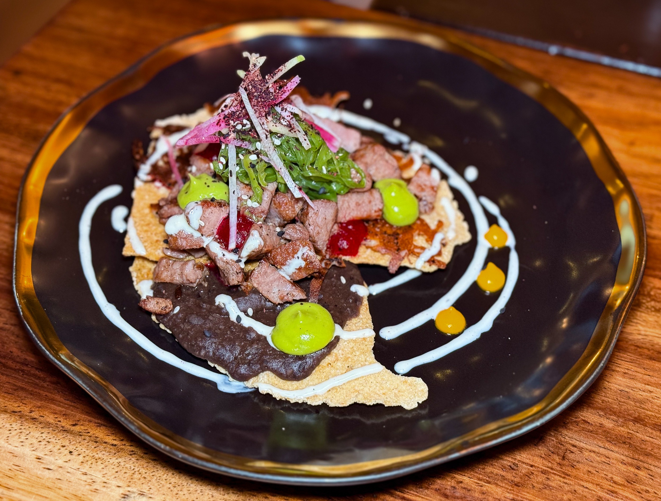Tostada Flank Steak w refried beans Mezcal & Sal Puerto Vallarta
