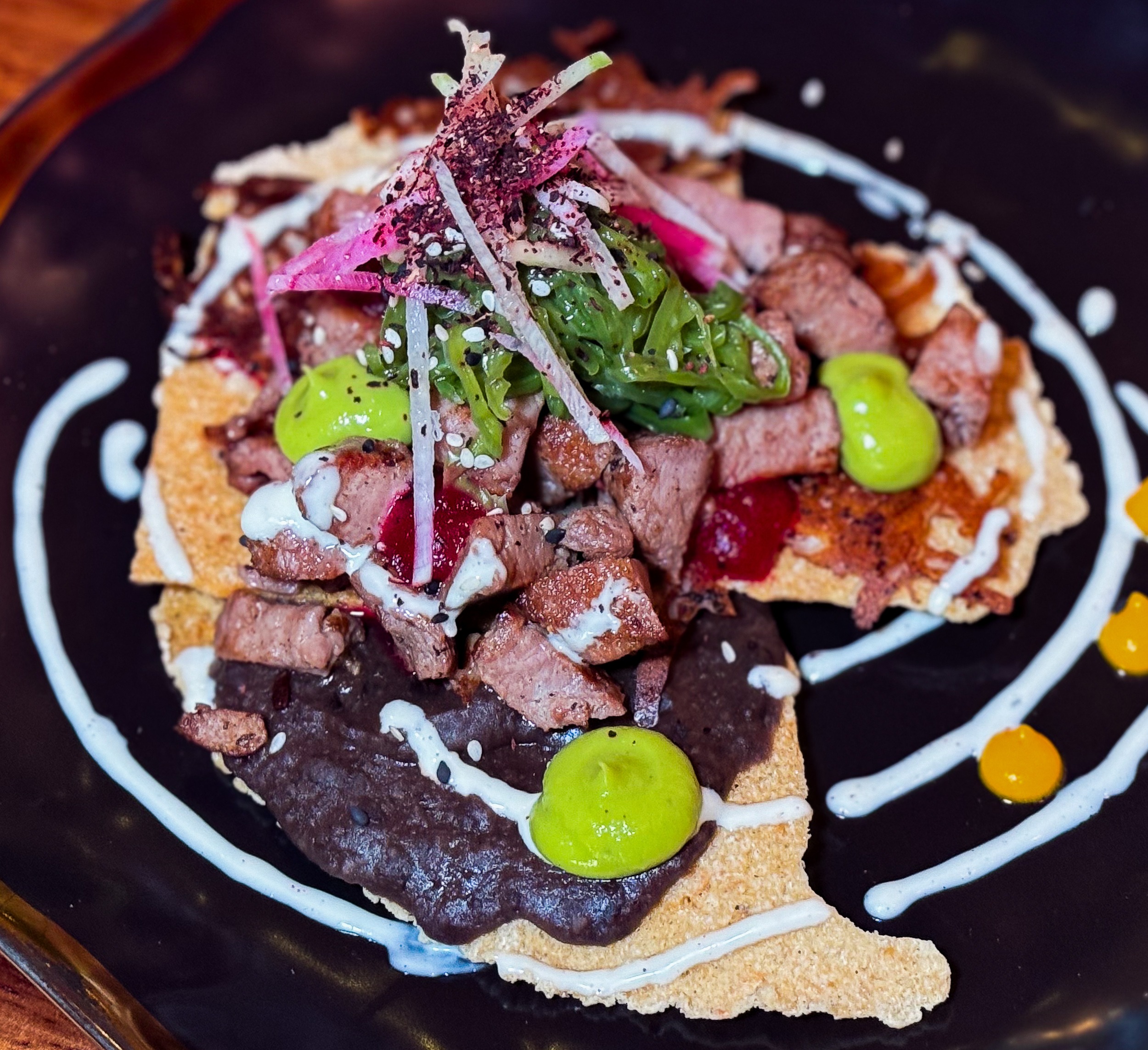 Tlayudas - Tostada Flank Steak w refried beans Mezcal & Sal Puerto Vallarta